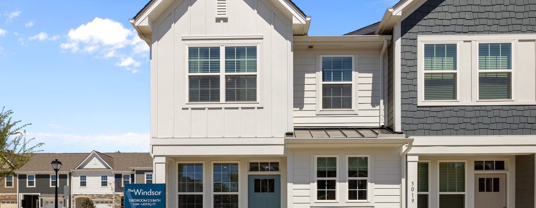 a white building with a blue sign
