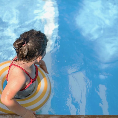 a baby in a swimming pool