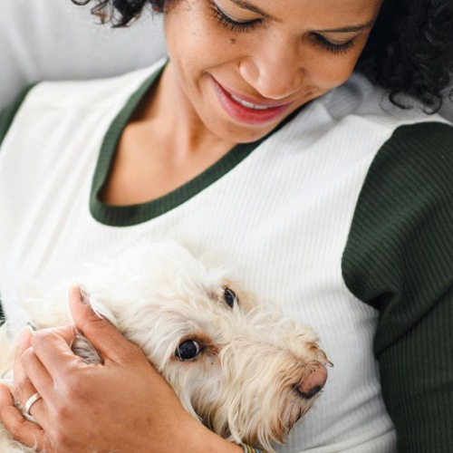a person holding a dog