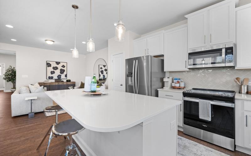 a kitchen with white cabinets