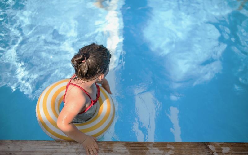 a baby in a swimming pool